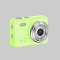 Green digital camera with silver lens on a white background