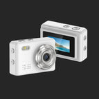 White digital camera with a screen displaying a scenic image on a white background