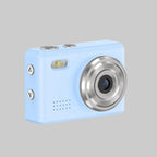 Small blue camera with a silver lens on a white background